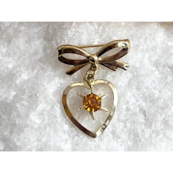 Gold Toned Matte Ribboned Bow Heart Shaped Orange Rhinestoned Brooch - Picture 1 of 9